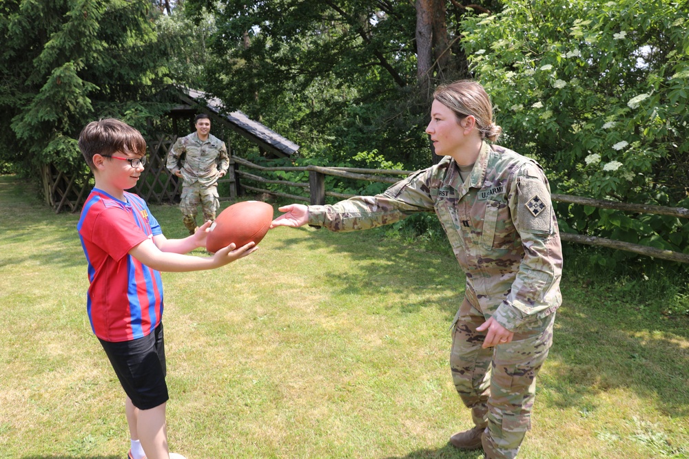 4th Infantry Division Soldiers participate in a cookout with students at an English language school in Boleslawiec, Poland