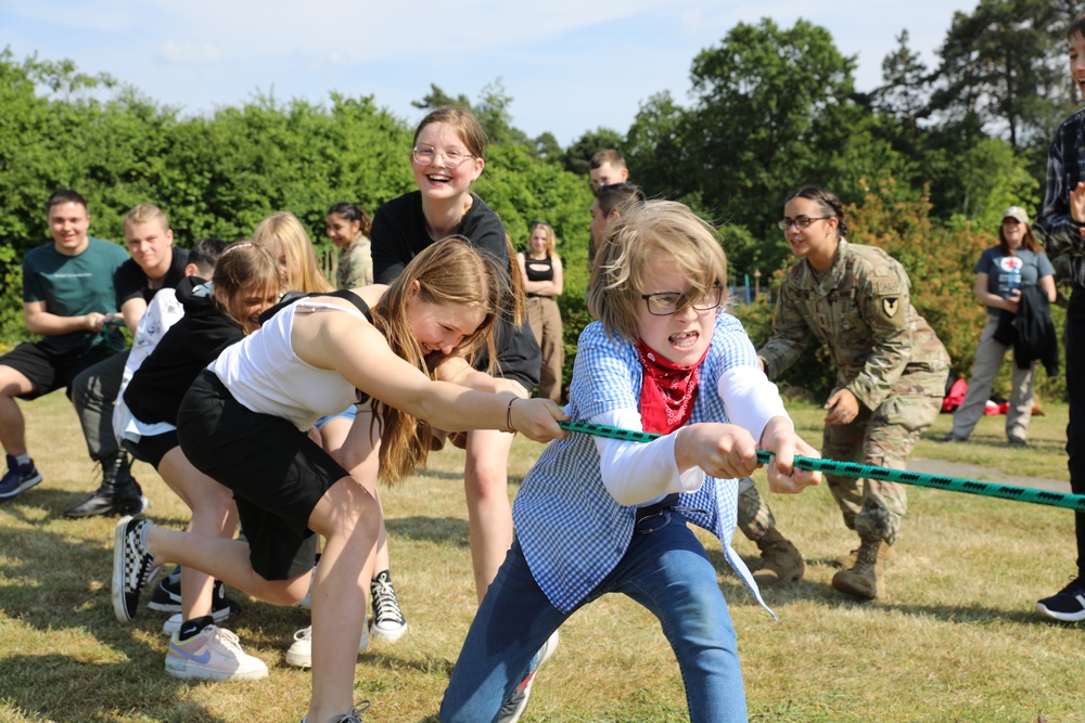 4th Infantry Division Soldiers participate in a cookout with students at an English language school in Boleslawiec, Poland