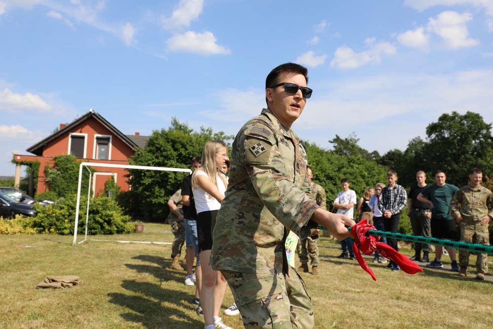 4th Infantry Division Soldiers participate in a cookout with students at an English language school in Boleslawiec, Poland