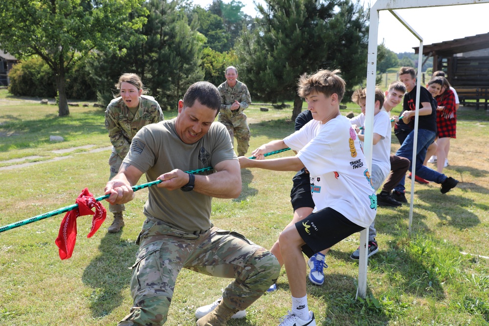 4th Infantry Division Soldiers participate in a cookout with students at an English language school in Boleslawiec, Poland