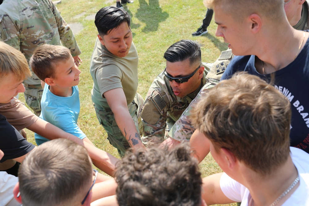 4th Infantry Division Soldiers participate in a cookout with students at an English language school in Boleslawiec, Poland