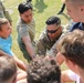 4th Infantry Division Soldiers participate in a cookout with students at an English language school in Boleslawiec, Poland