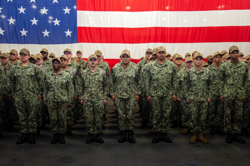 Boxer Promotes 128 Sailors in Ceremony