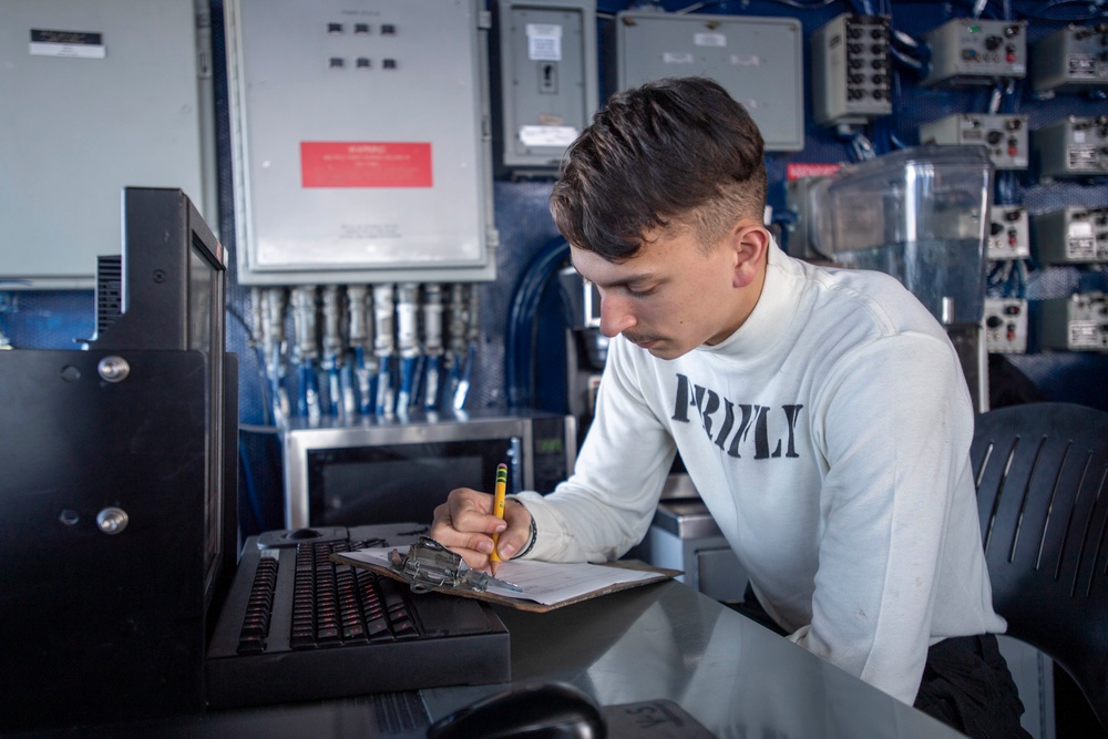 U.S. Navy Sailor Tracks Aircraft