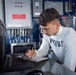 U.S. Navy Sailor Tracks Aircraft