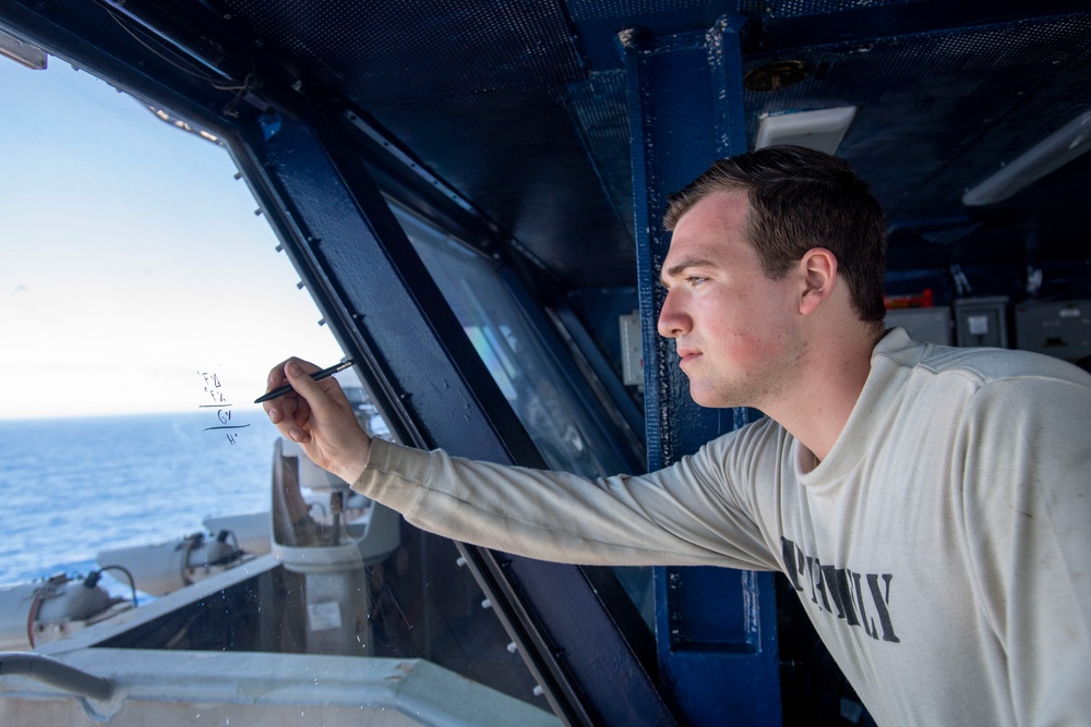 U.S. Navy Sailor Tracks Aircraft