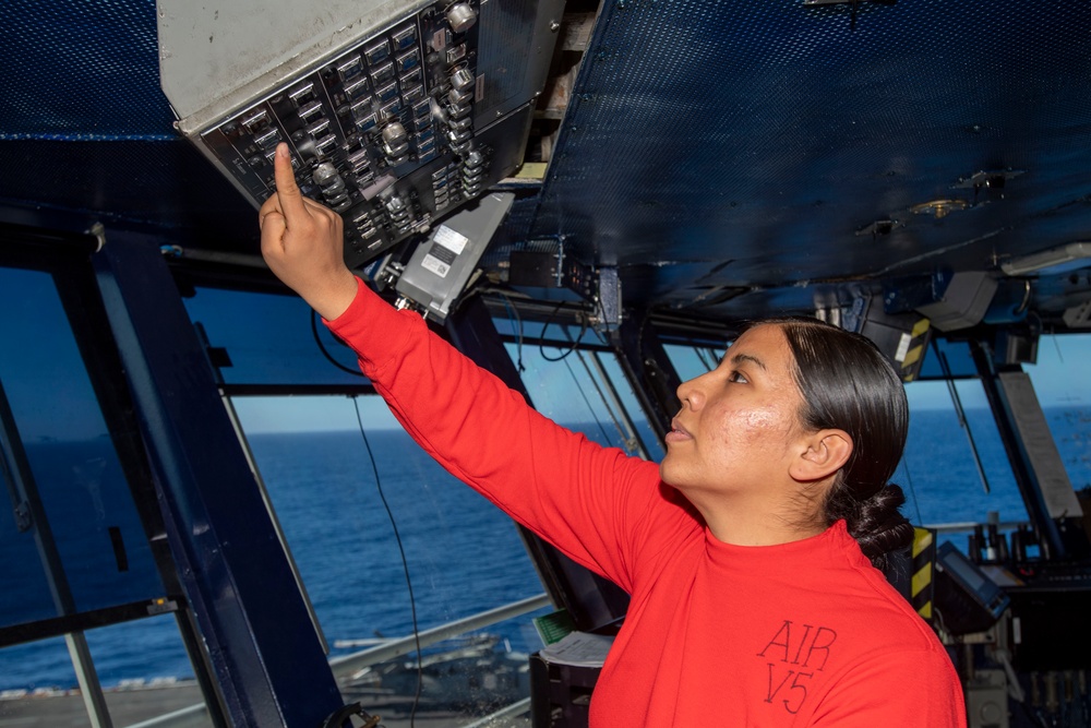 U.S. Navy Sailor Sets Aircraft Recovery Flight Deck Lights