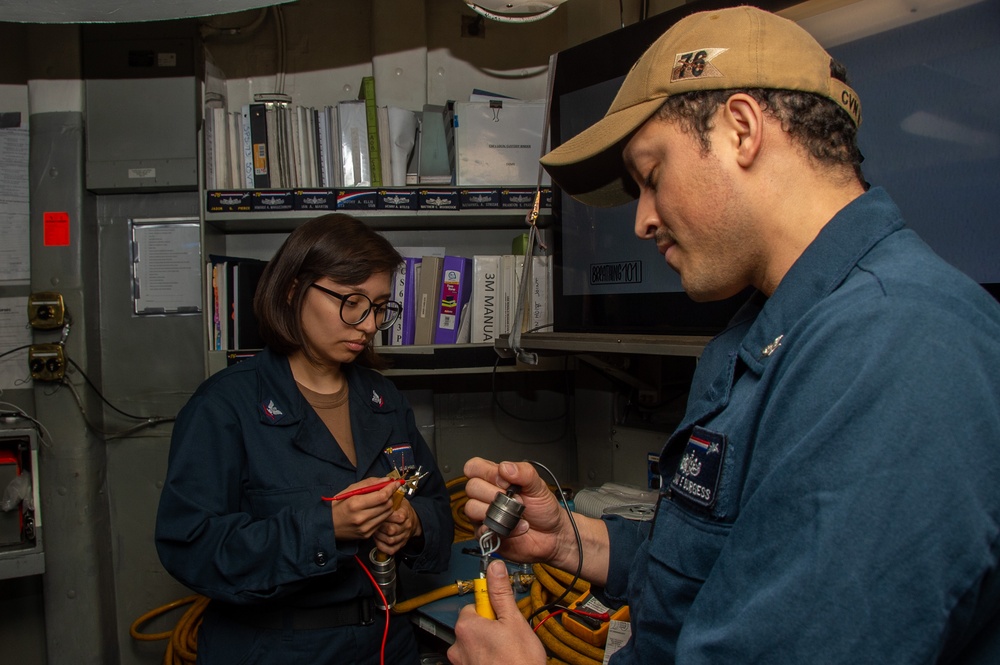 USS Ronald Reagan (CVN 76) Sailors maintain internal communication systems