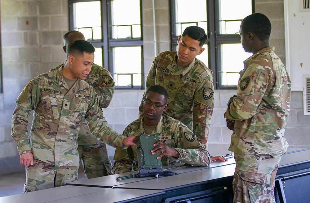 50th Regional Support Group HHC Soldiers practice radio skills during AT