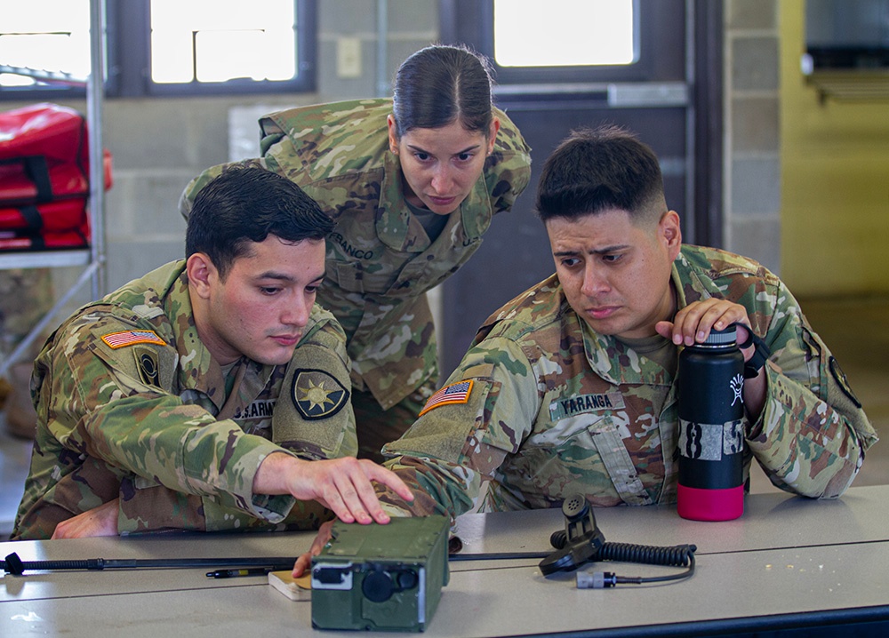 50th Regional Support Group HHC Soldiers practice radio skills during AT