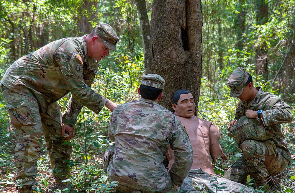 50th Regional Support Group HHC Soldiers practice combat first aid skills during AT