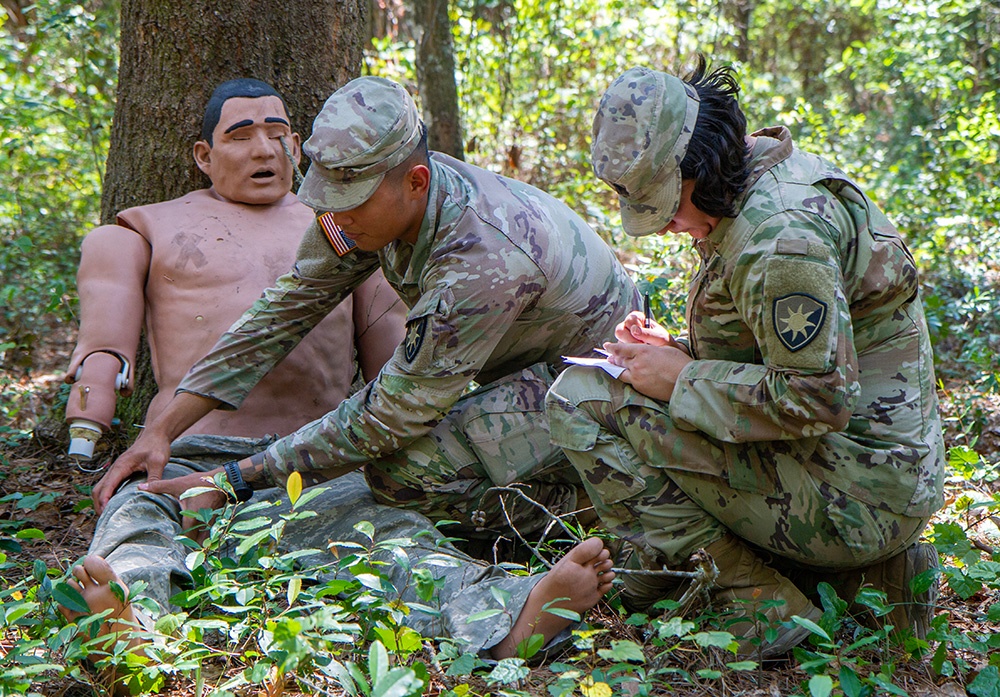 50th Regional Support Group HHC Soldiers practice combat first aid skills during AT