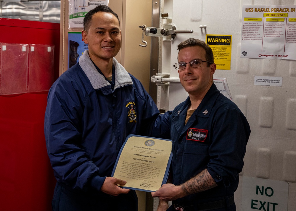 USS Rafael Peralta (DDG 115) conducts a reenlistment on the messdecks