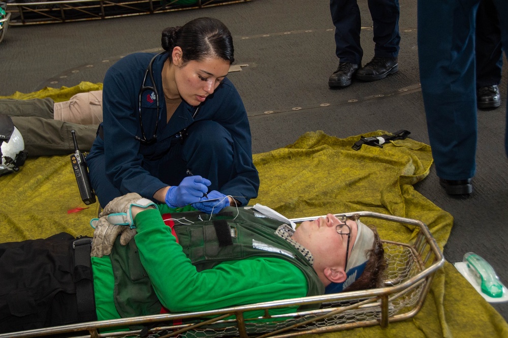 USS Ronald Reagan (CVN 76) sailors simulate a Mass Casualty