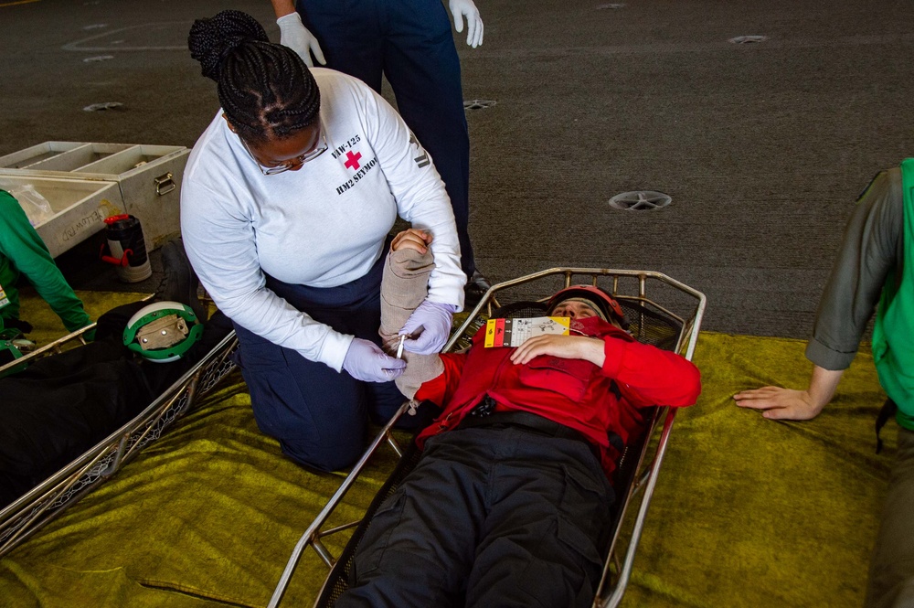 USS Ronald Reagan (CVN 76) sailors simulate a Mass Casualty