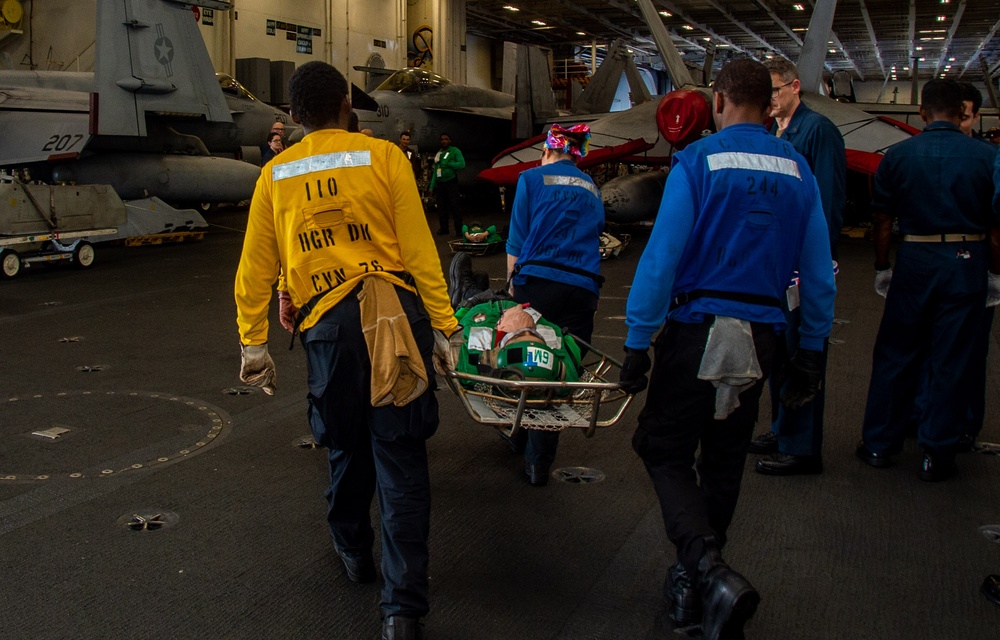 USS Ronald Reagan (CVN 76) sailors simulate a Mass Casualty