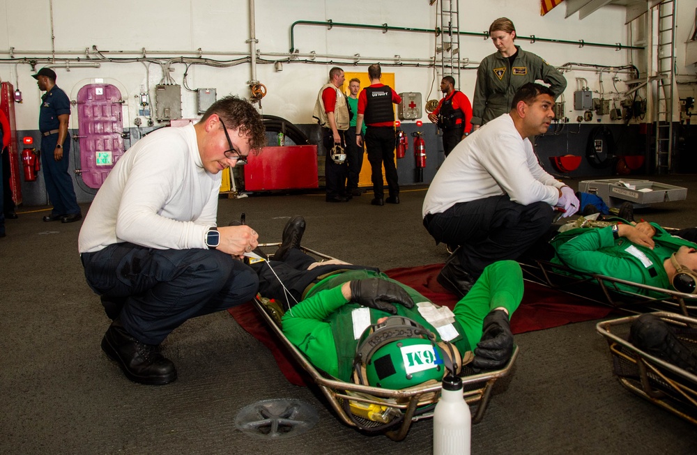 USS Ronald Reagan (CVN 76) sailors simulate a Mass Casualty
