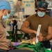 USS Ronald Reagan (CVN 76) sailors simulate a Mass Casualty