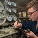 USS Ronald Reagan (CVN 76) Sailor stands steering gear room watch