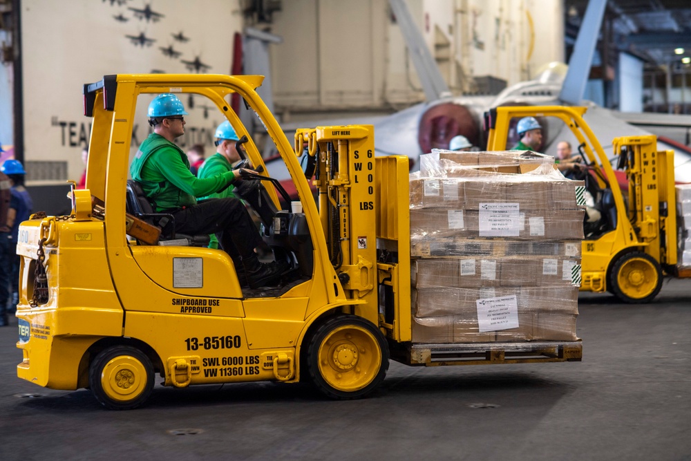 U.S. Navy Sailor Drives Forklift