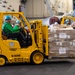 U.S. Navy Sailor Drives Forklift