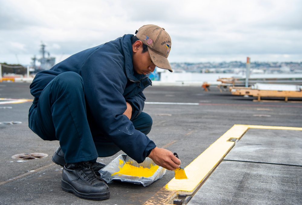 Sailor Paints Flight Deck aboard USS Carl Vinson