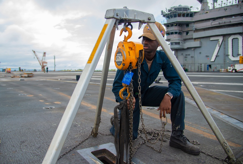 Sailor Preforms Maintenance Flight Deck Aboard USS Carl Vinson (CVN 70)