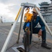 Sailor Preforms Maintenance Flight Deck Aboard USS Carl Vinson (CVN 70)