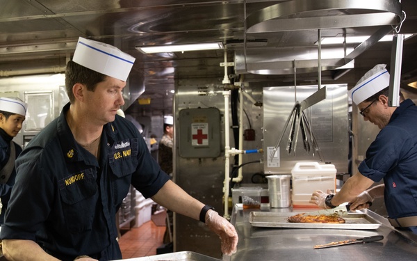 USS Harpers Ferry (LSD 49) Chiefs Mess cooks dinner for the crew