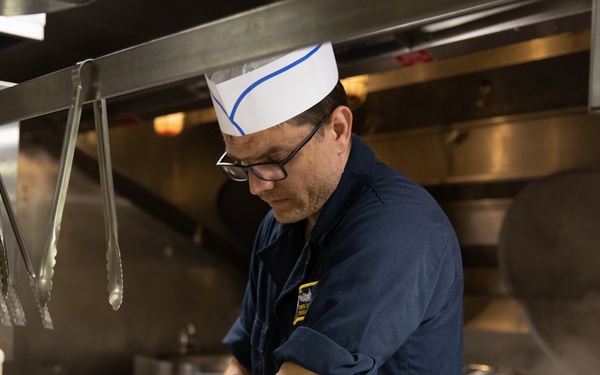 USS Harpers Ferry (LSD 49) Chiefs Mess cooks dinner for the crew