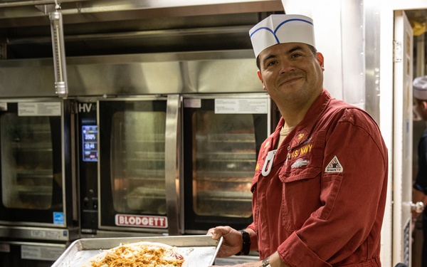 USS Harpers Ferry (LSD 49) Chiefs Mess cooks dinner for the crew