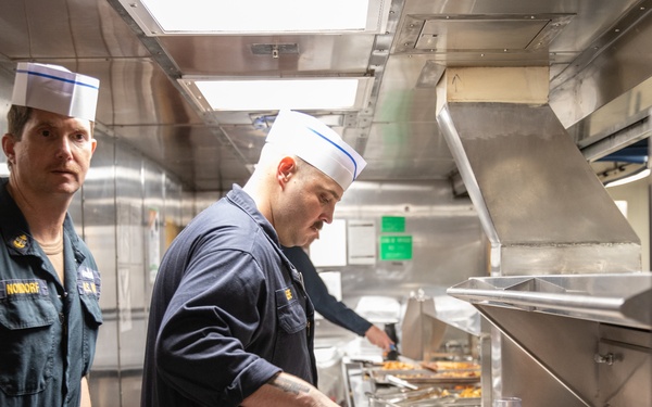 USS Harpers Ferry (LSD 49) Chiefs Mess cooks dinner for the crew