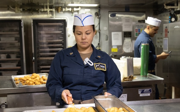 USS Harpers Ferry (LSD 49) Chiefs Mess cooks dinner for the crew
