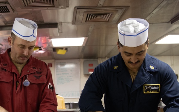 USS Harpers Ferry (LSD 49) Chiefs Mess cooks dinner for the crew