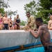 Army Reserve Sgt. Asuerus Thompson climbs an obstacle