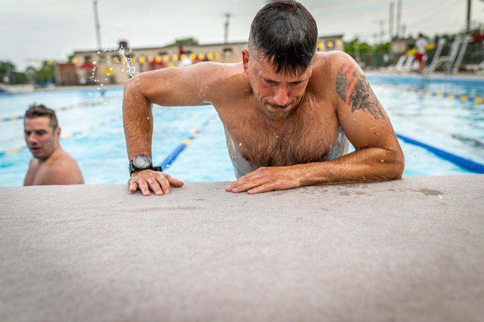 Army Reserve Staff Sgt. James Lavoie climbs an obstacle