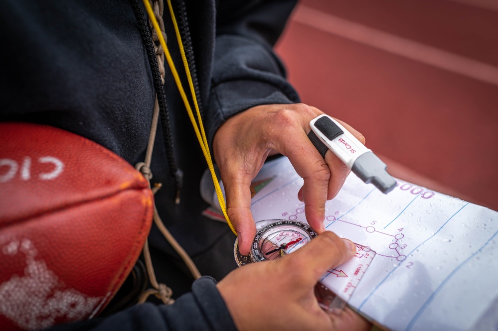 Army Reserve 1st Lt. Brianna Mirmina checks her compass