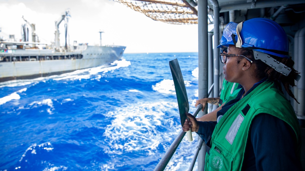 USS Robert Smalls (CG 62) Sailor Signals during RAS with USNS Rappahannock (T-AO-204)