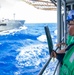 USS Robert Smalls (CG 62) Sailor Signals during RAS with USNS Rappahannock (T-AO-204)