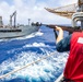 USS Robert Smalls (CG 62) Gunner's Mate Prepares to Shoot Shot Line