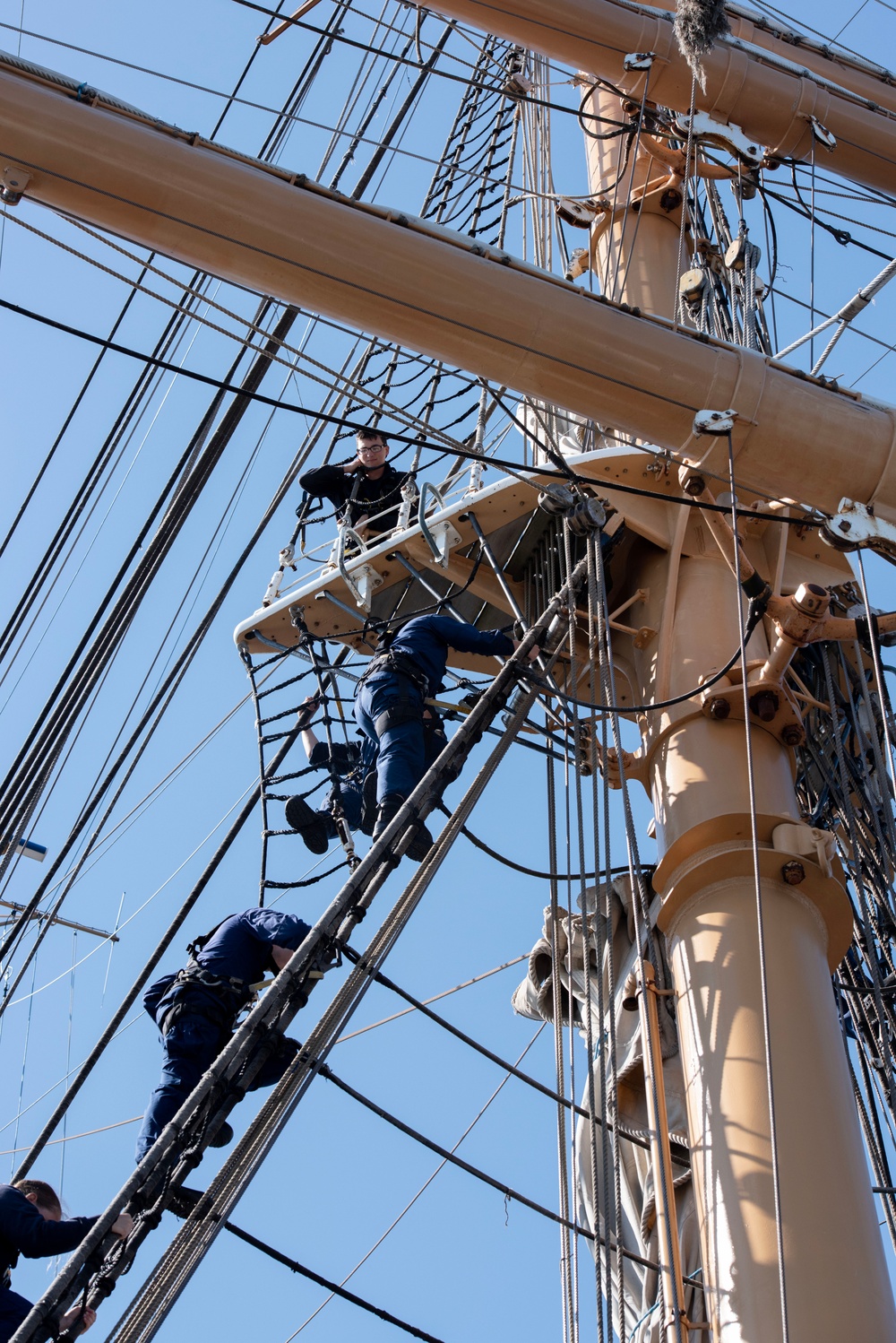 USCGC Eagle crewmember helps cadets climb