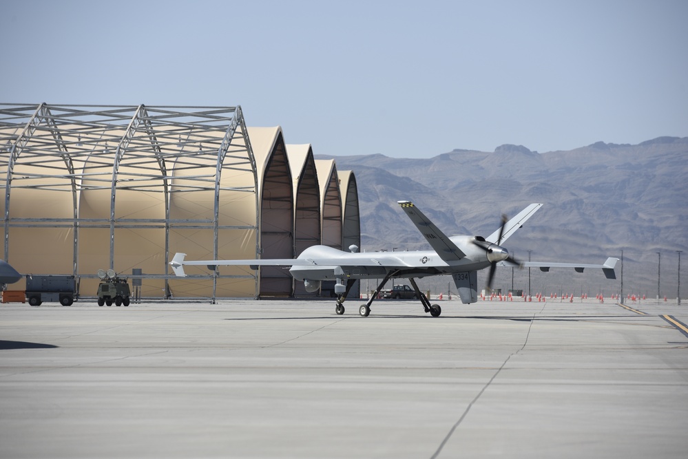 Prepping the MQ-9 Reaper for flight; So it can soar its first iteration of an ACE exercise.