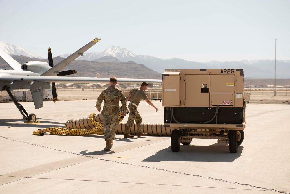 Prepping the MQ-9 Reaper for flight; So it can soar in its first iteration of an ACE exercise.