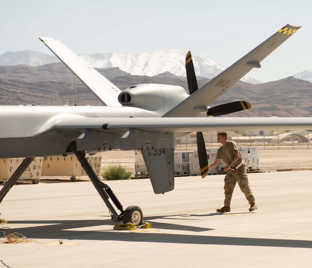 Prepping the MQ-9 Reaper for flight; So it can soar its first iteration of an ACE exercise.