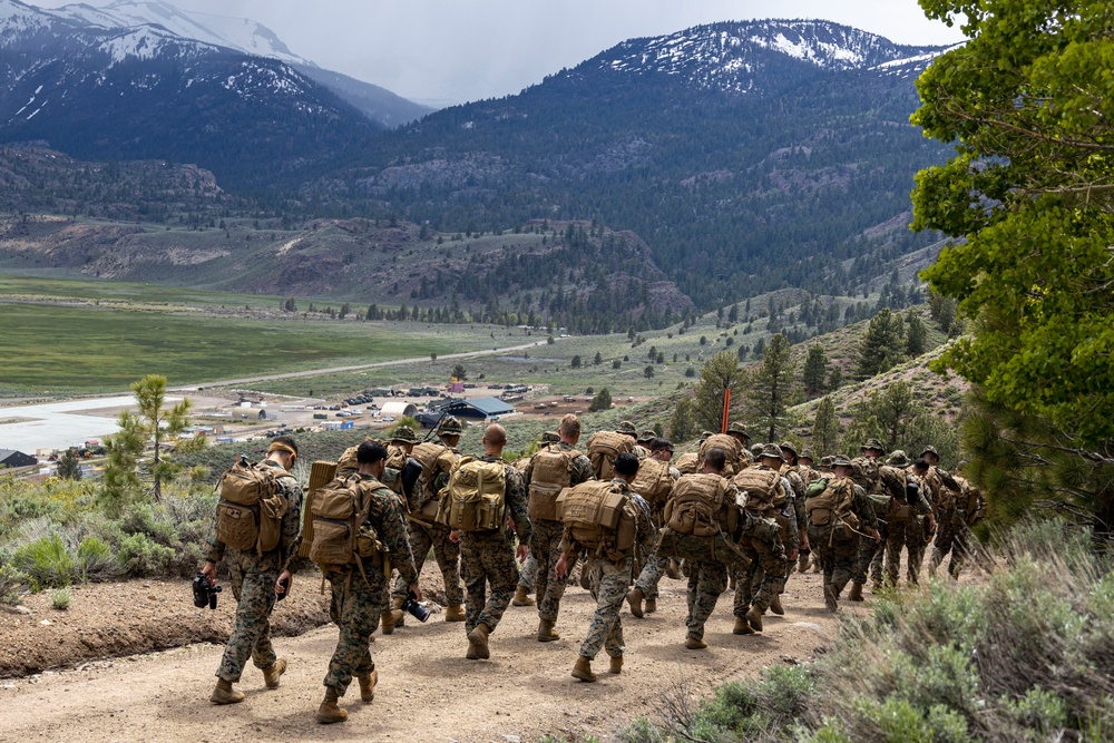 Marines with 2/23 conduct a conditioning hike during MTX 4-23