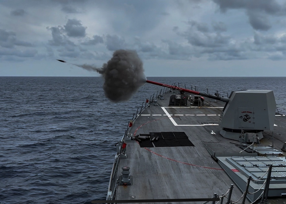 USS Rafael Peralta (DDG 115) fires a Mark 45 5-inch gun during a live fire exercise