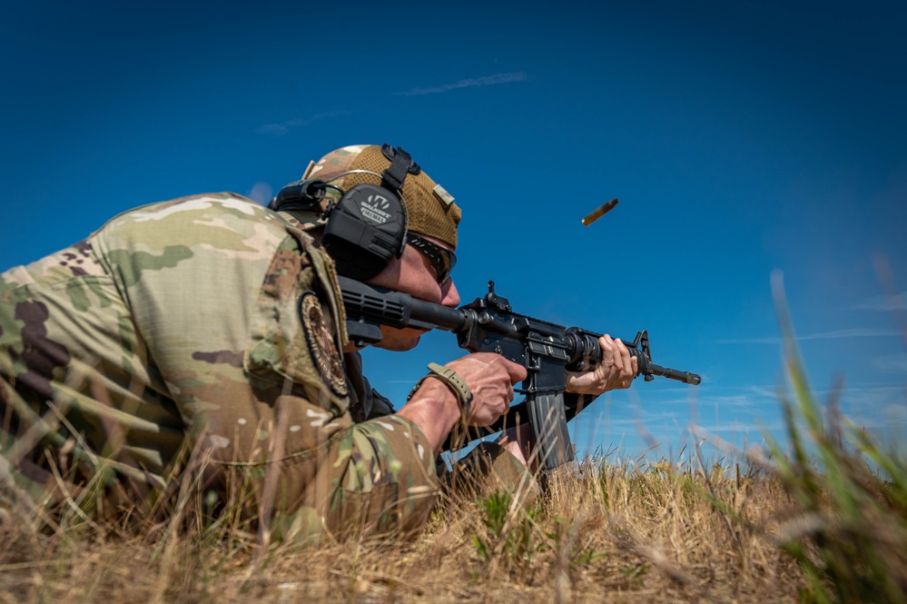 Air Force Reserve Maj. James Fink fires M4 rifle