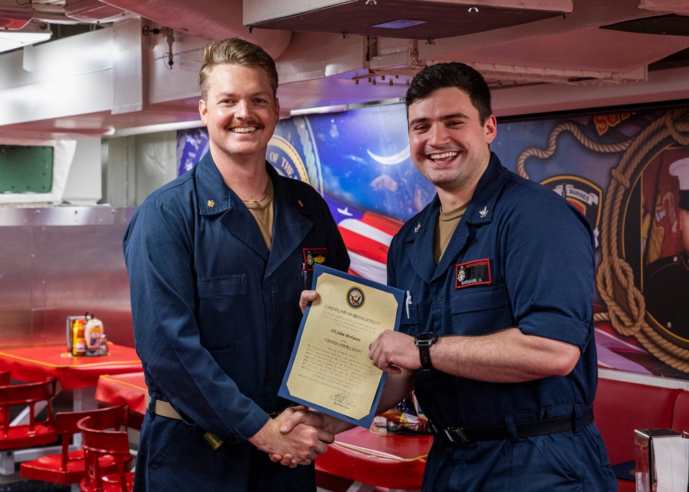 USS Rafael Peralta (DDG 115) conducts a reenlistment on the messdecks