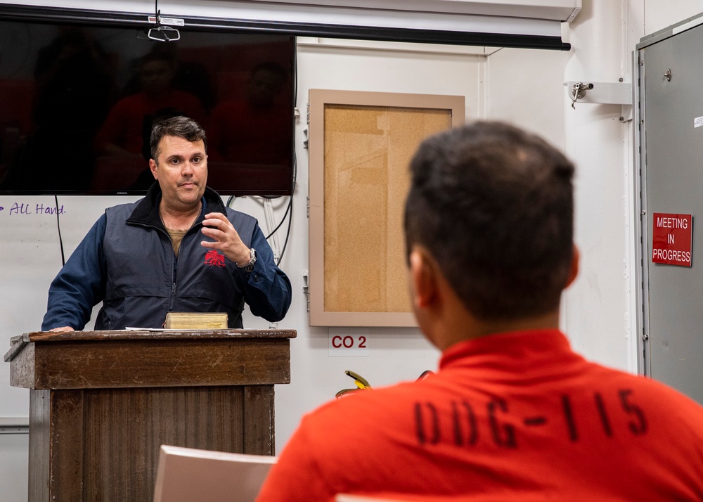 USS Rafael Peralta (DDG 115) conducts bible study in the Crew Training Room