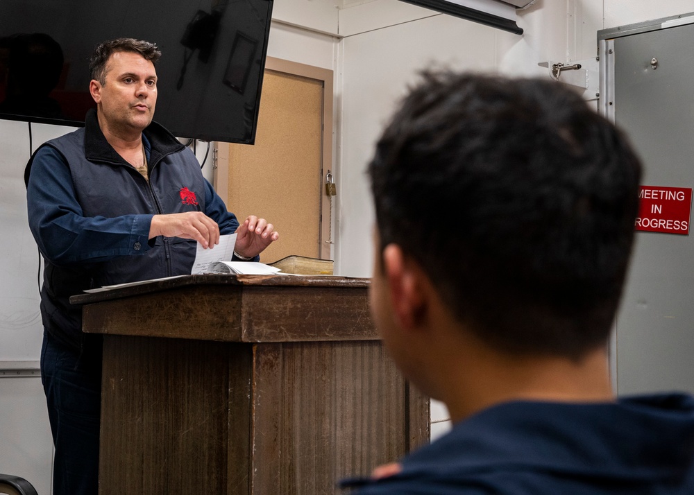 USS Rafael Peralta (DDG 115) conducts bible study in the Crew Training Room